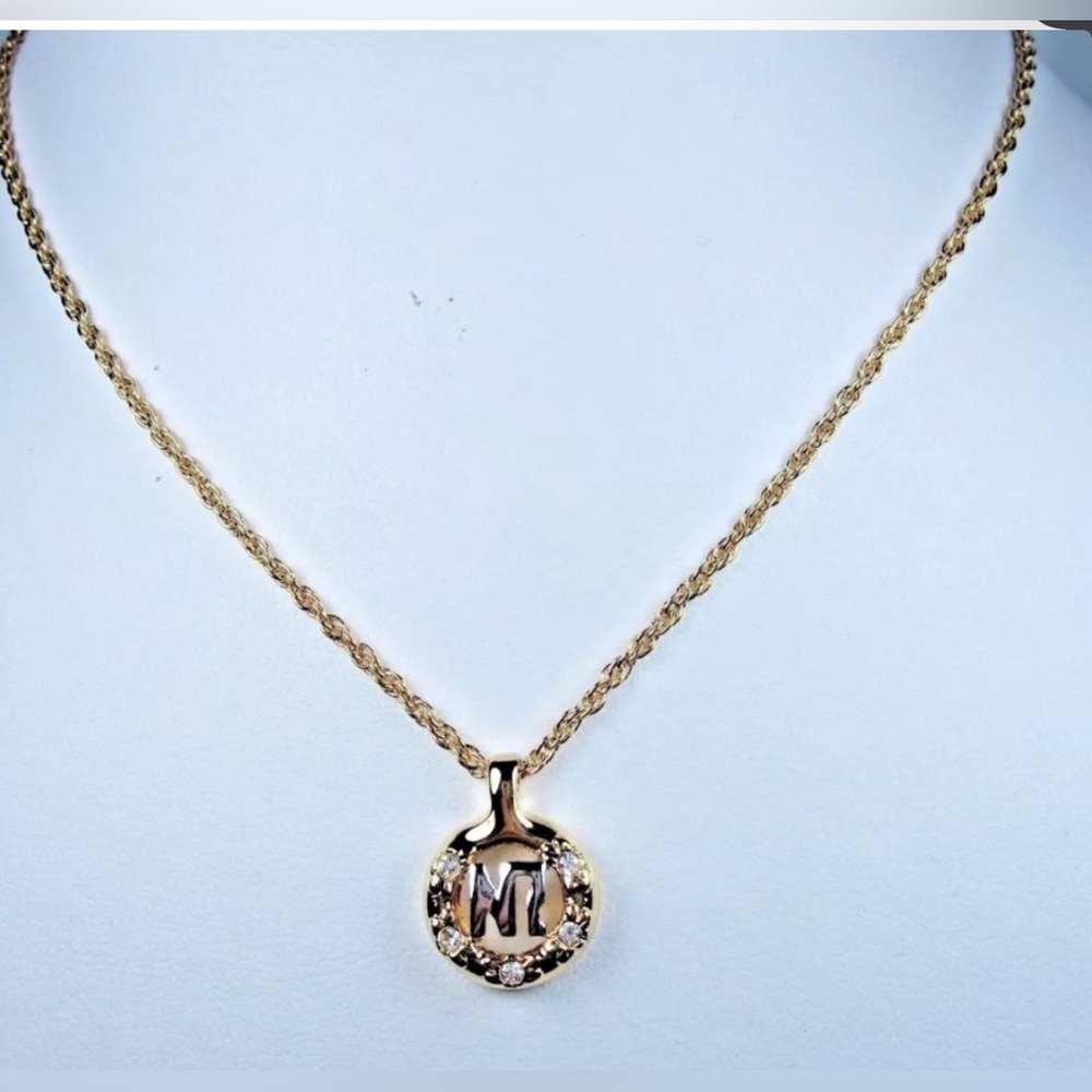 NWT Nina Ricci Gold Plated
Pendant logo & Swarovski Crystals
16-18" length
